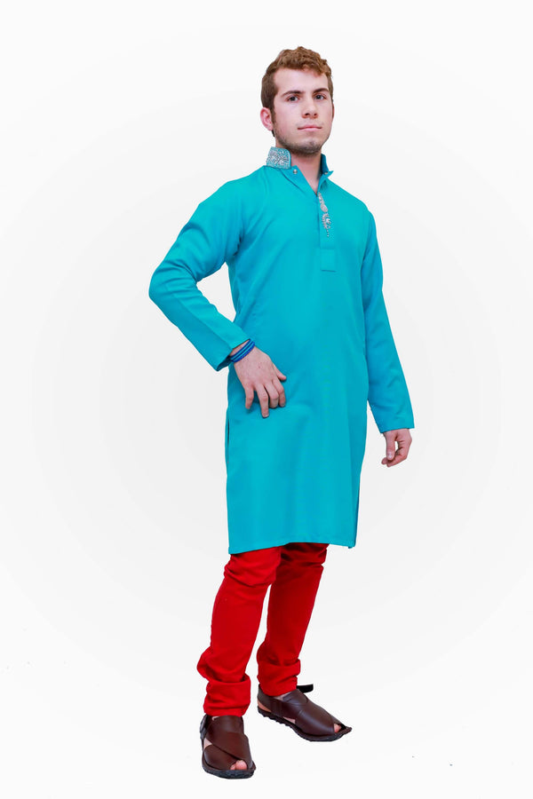 A cotton turquoise blue shirt with silver embroidery around the neckline