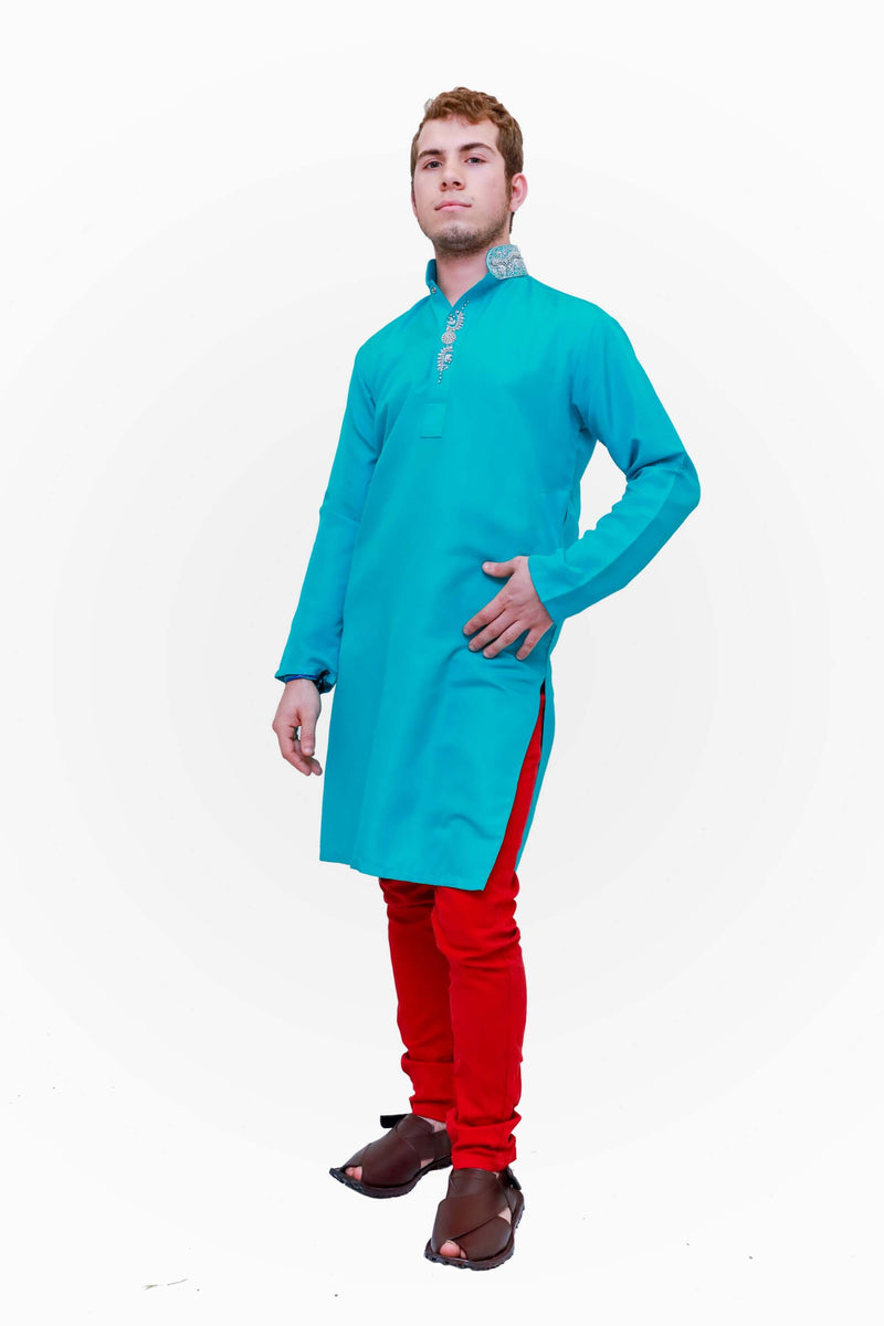A cotton turquoise blue shirt with silver embroidery around the neckline
