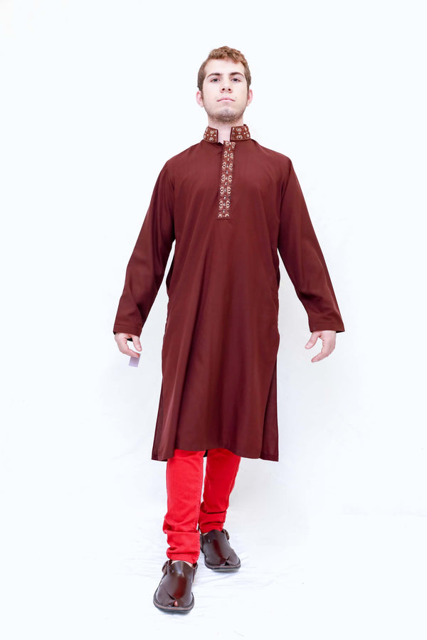 A dark red cotton shirt with tan embroidering around the neckline