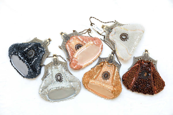 Elegantly sequenced shimmering on this stunning clutch is embellished with drop-in chain strap