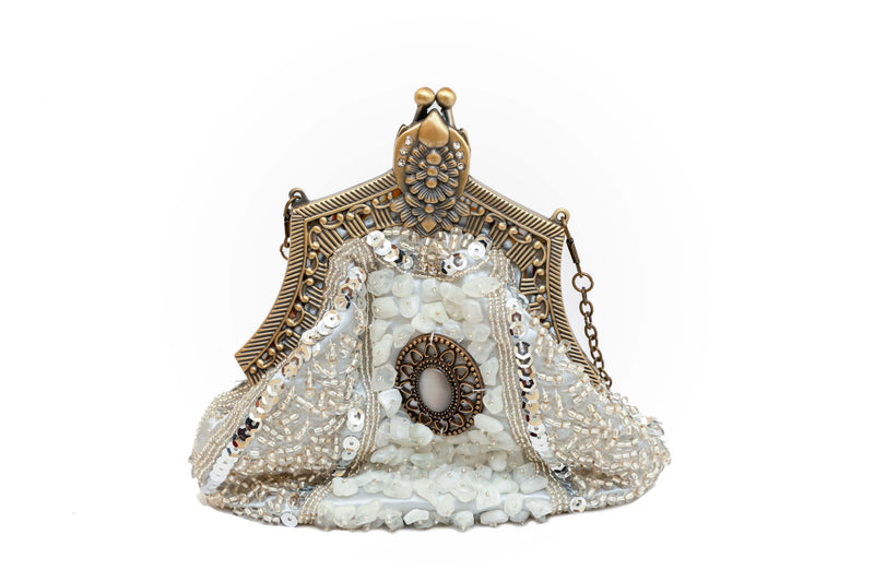 Elegantly sequenced shimmering on this stunning clutch is embellished with drop-in chain strap