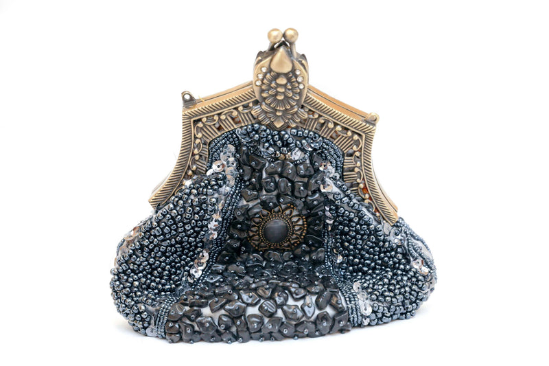 Elegantly sequenced shimmering on this stunning clutch is embellished with drop-in chain strap